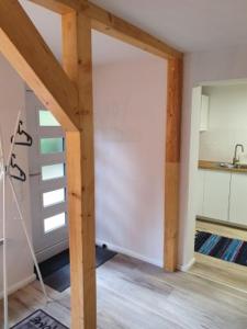 a room with an open door to a kitchen at Forsthaus Timmerloher Weg in Schneverdingen