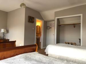 Postel nebo postele na pokoji v ubytování Harveys Guest House