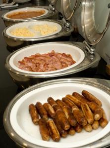 plates of food are lined up on a counter at Ibis Sheffield City in Sheffield