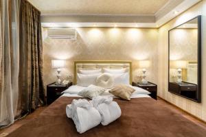 
Кровать или кровати в номере Отель Бомонд на Ленинском Проспекте
