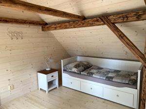 a bedroom with a bed in a attic at Chaloupka Jizerské hory in Janov nad Nisou