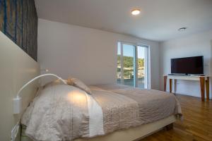 Кровать или кровати в номере Luxury Blue Villas Vis