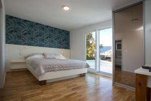 Кровать или кровати в номере Luxury Blue Villas Vis