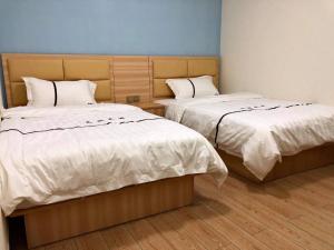 Ένα ή περισσότερα κρεβάτια σε δωμάτιο στο Li Jie Coffee Homestay