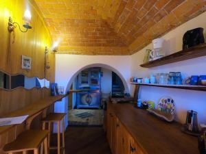 a kitchen with a large wooden counter in a room at Bed and breakfast Ca du 5 in Tovo San Giacomo