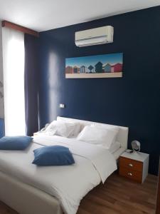 Postel nebo postele na pokoji v ubytování Hotel Le Griffon