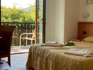 Postel nebo postele na pokoji v ubytování Casa Vacanze Orchidea