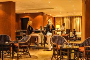 a group of women standing in a restaurant at Solymar Ivory Suites in Hurghada