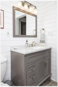 a bathroom with a sink and a mirror at Heart of Highlands 3BR Loft in Louisville