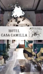 a sign for a hotel casa cantina with chairs and a table at Hotel Casa Camilla in Verbania