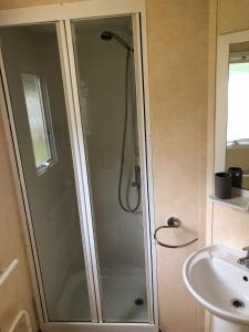 a shower in a bathroom next to a sink at Lakeside Holiday Rentals - Arizona in Great Billing