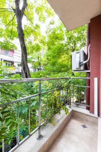 a balcony with a view of a tree at 1BD apartment in a calm area near the centre in Plovdiv