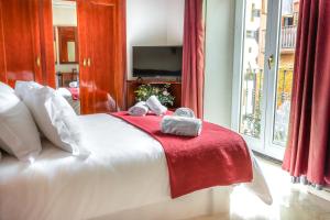 Ein Bett oder Betten in einem Zimmer der Unterkunft Hotel Reina Cristina