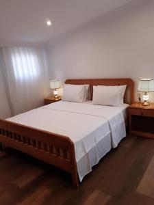 a bedroom with a large bed with two night stands at Central Park Otel - Adult Only in Dalyan