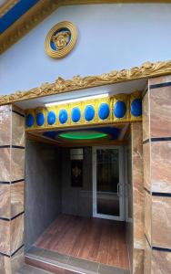 a entrance to a building with blue and gold at Отель "Золотой Лотос" in Khosta