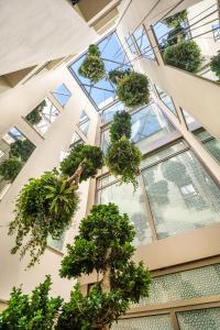 an office building with plants in the ceiling at El Llorenc Parc de la Mar - Adults Only (+16) in Palma de Mallorca