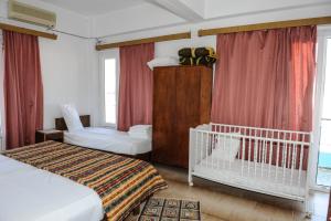 Postel nebo postele na pokoji v ubytování Hotel Karpathos