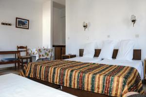 Postel nebo postele na pokoji v ubytování Hotel Karpathos