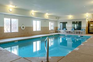 a swimming pool with blue water in a house at Sleep Inn & Suites Hobbs in Hobbs +48 photos