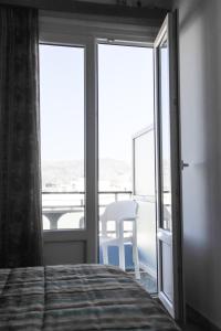 Postel nebo postele na pokoji v ubytování Hotel Karpathos