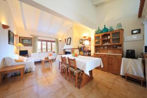 a living room with a table and a couch at Cana Joana in Santa Margalida