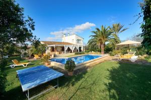 a house with a swimming pool in the yard at Cana Joana in Santa Margalida