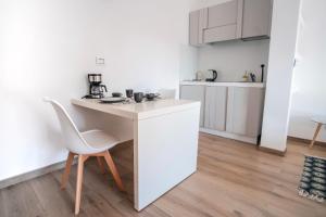 Kuchyň nebo kuchyňský kout v ubytování Rossani Suites&Aparts