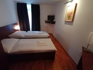 Postel nebo postele na pokoji v ubytování Hotel Arli