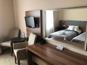 Postel nebo postele na pokoji v ubytování Hotel Komfort