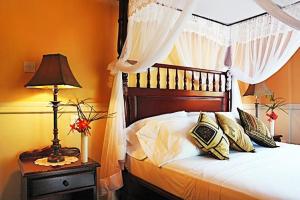 Krevet ili kreveti u jedinici u okviru objekta Spring Hotel Bequia