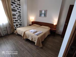 Posteľ alebo postele v izbe v ubytovaní Porto Lesvos hotel