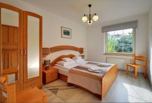 Posteľ alebo postele v izbe v ubytovaní ApartamentVanessa
