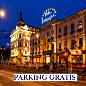 a building with the words parking gratis in front of it at Hotel Europejski in Krakow
