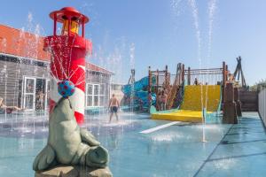 a water park with a playground with a water fountain at Hotel De Zeeuwse Kust (family only) in Renesse