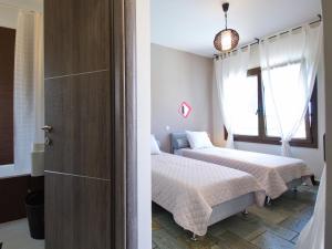 Postel nebo postele na pokoji v ubytování Villa Minetti