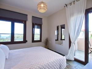 Postel nebo postele na pokoji v ubytování Villa Minetti