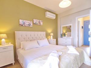 Posteľ alebo postele v izbe v ubytovaní Villa Odysseus Spartia Kefalonia