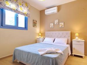 Posteľ alebo postele v izbe v ubytovaní Villa Odysseus Spartia Kefalonia