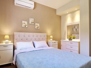 Posteľ alebo postele v izbe v ubytovaní Villa Odysseus Spartia Kefalonia