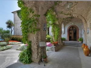 an entrance to a building with ivy growing on it at Hotel Parsifal - Antico Convento del 1288 in Ravello