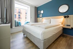 Postel nebo postele na pokoji v ubytování HARBR. hotel Konstanz