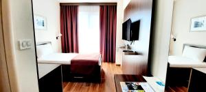 TV a/nebo společenská místnost v ubytování Hotel DOA
