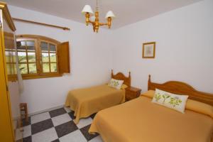 Cama o camas de una habitación en El Almendral