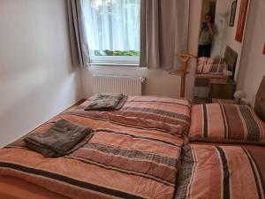 a bedroom with a bed with two pillows on it at Ferienwohnung Fellnasen WG 2 in Krefeld