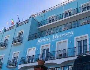 a blue building with a sign on it at Relais Maresca Luxury Small Hotel & Terrace Restaurant in Capri