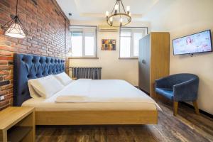 Postel nebo postele na pokoji v ubytování Secret Apartments