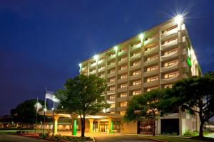 a hotel with lights on top of a building at Holiday Inn Austin Midtown by IHG in Austin