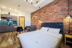 Postel nebo postele na pokoji v ubytování Secret Apartments