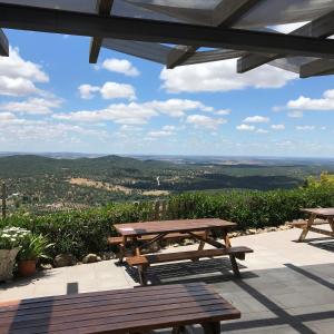 a picnic table on a patio with a view at The Place at Evoramonte in Évora Monte