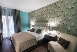 Theasis Hotel Paramythia客房内的一张或多张床位